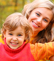 photo of smiling mother and daughter